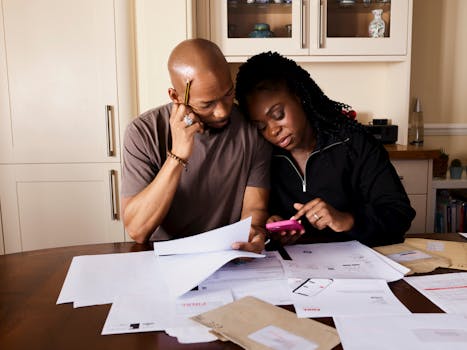 Image of a nurse calculating expenses with a calculator