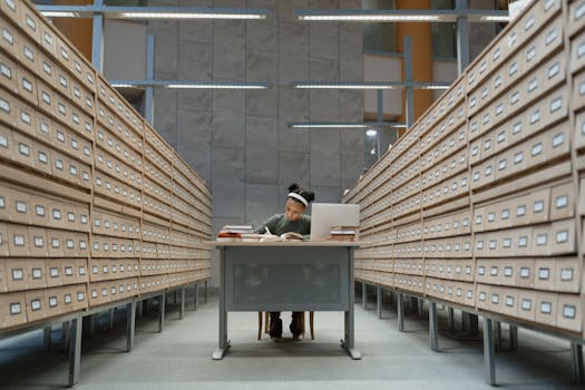 Image of a nursing student studying with textbooks