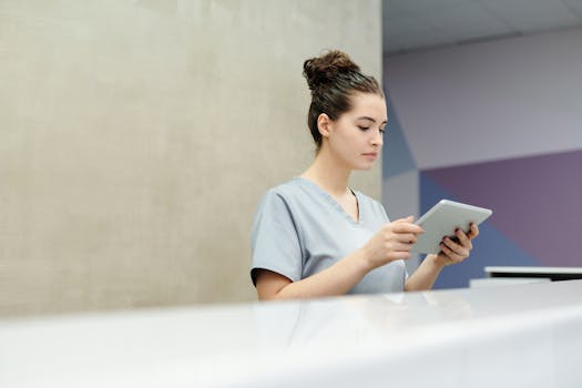 nurse organizing tasks on a tablet