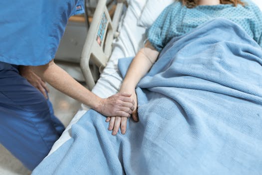 nurse assisting patient in a hospital